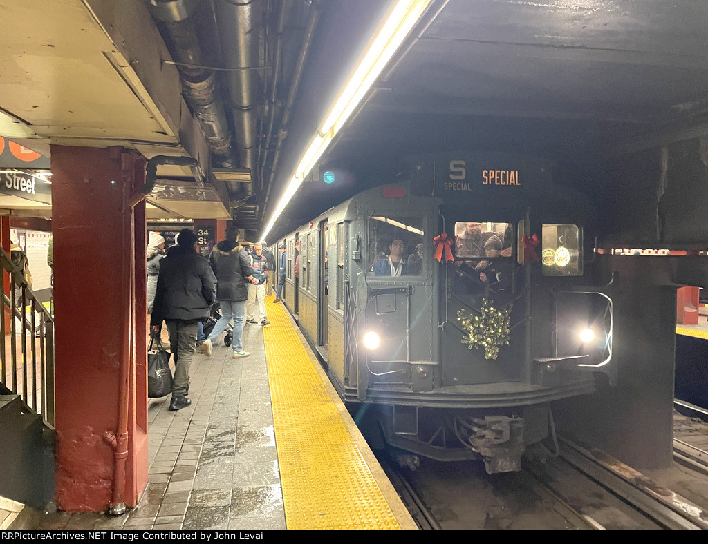 Southbound late morning NYCTA Holiday Train stopped at 34th St-Herald Square Station 